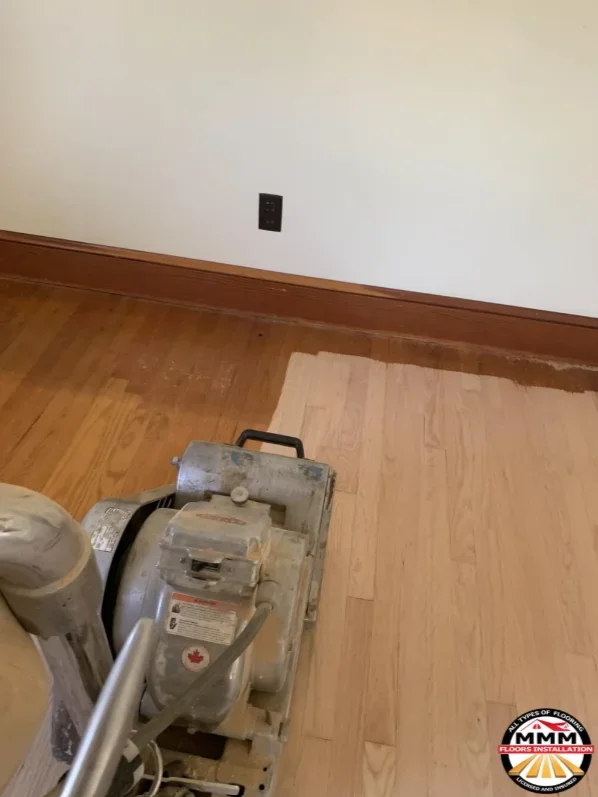 Hardwood floor sanding and refinishing with professional equipment and prepared wood surface