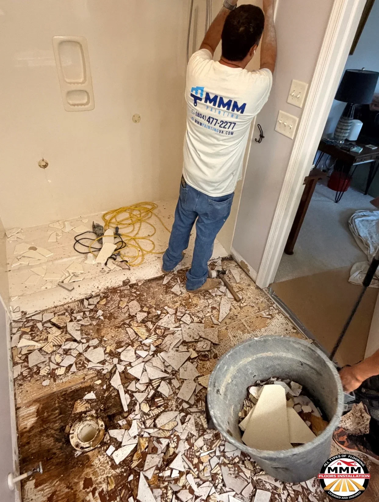 Drywall demolition with debris removal and wall preparation for flooring work